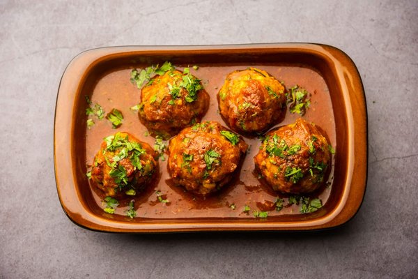 How to Make a Traditional Middle Eastern Kofta with a Spicy Tomato Sauce?